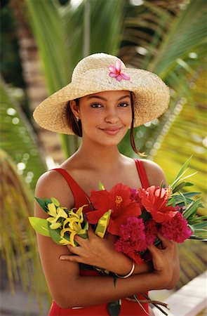 saint martin caribbean - Portrait de femme tenant des fleurs Saint-Martin, Antilles Photographie de stock - Rights-Managed, Code: 700-00018332