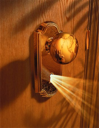 Globe Doorknob with Light through Keyhole Stock Photo - Rights-Managed, Code: 700-00018653