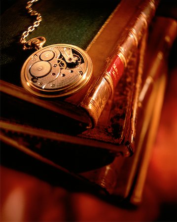 pocket watch - Pocket Watch with Exposed Gears On Stack of Antique Books Stock Photo - Rights-Managed, Code: 700-00019906