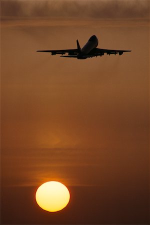 simsearch:700-00026618,k - Silhouette of Boeing 747 Taking Off at Sunset Stock Photo - Rights-Managed, Code: 700-00012507