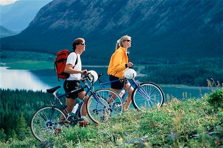 Couple with Mountain Bikes Kananaskis Country, AB, Canada Stock Photo - Rights-Managed, Code: 700-00012814