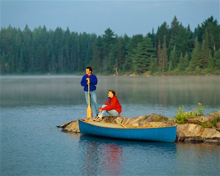 Couple by Lake with Canoe Tom Thompson Lake, Algonquin Park Ontario, Canada Stock Photo - Rights-Managed, Code: 700-00013002