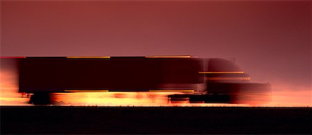 side view of a semi truck - Blurred Transport Truck at Dusk Stock Photo - Rights-Managed, Code: 700-00013447