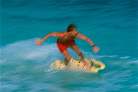 skimboard - Man Skimboarding in Swimwear Miami, Florida, USA Foto de stock - Direito Controlado, Número: 700-00024490