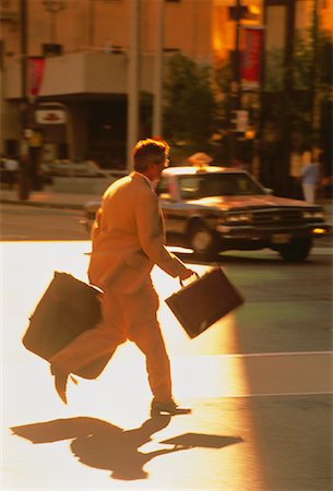 Businessman Running Outdoors at Sunset Toronto, Ontario, Canada Stock Photo - Rights-Managed, Code: 700-00024922