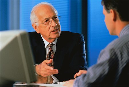 Mature Businessmen at Desk Stock Photo - Rights-Managed, Code: 700-00025024