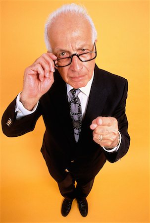 Portrait of Mature Businessman Pointing Finger Stock Photo - Rights-Managed, Code: 700-00025044