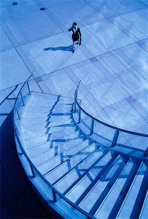 person on winding stairs - Businesswoman Approaching Spiral Staircase Toronto, Ontario, Canada Stock Photo - Rights-Managed, Code: 700-00025086