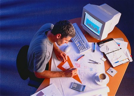 Businessman Working at Desk Foto de stock - Con derechos protegidos, Código: 700-00025154