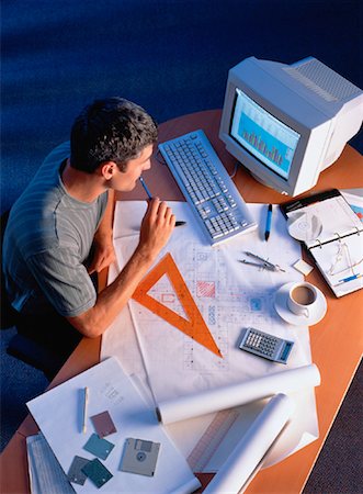 engineer at desk - Businessman Working at Desk Foto de stock - Con derechos protegidos, Código: 700-00025153