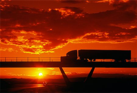 side view of a semi truck - Silhouette of Transport Truck on Road at Dusk Stock Photo - Rights-Managed, Code: 700-00025329