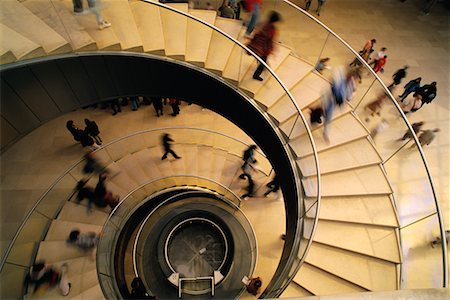person on winding stairs - Looking Down at People Walking On Spiral Staircase Stock Photo - Rights-Managed, Code: 700-00025330