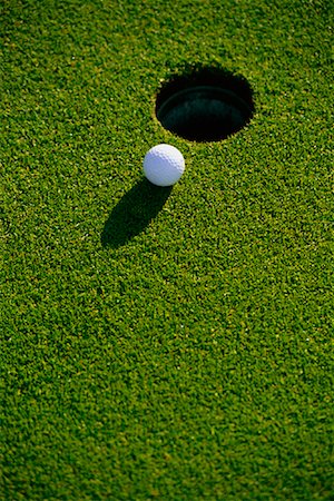 Close-Up of Golf Ball near Cup on Green Ontario, Canada Stock Photo - Rights-Managed, Code: 700-00026194