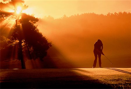 Silhouette of Golfer at Sunset Ontario, Canada Fotografie stock - Rights-Managed, Codice: 700-00026550