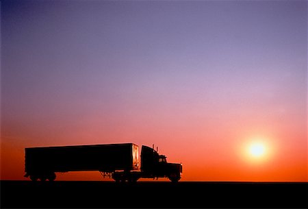 side view of a semi truck - Silhouette of Transport Truck at Sunset Stock Photo - Rights-Managed, Code: 700-00026681