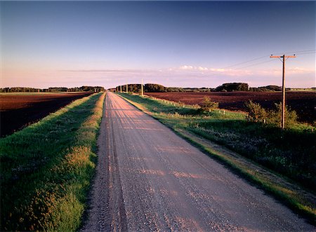 Gravel Road at Sunset Near Summerfallow Fields Near Russell, Manitoba, Canada Stock Photo - Rights-Managed, Code: 700-00026739