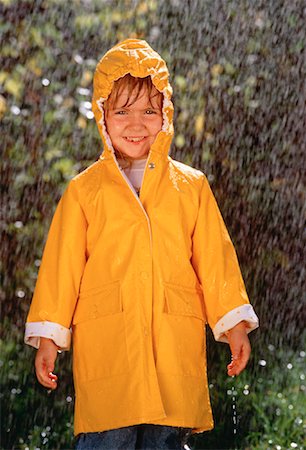 rain little girl - Portrait de jeune fille portant un imperméable sous la pluie Photographie de stock - Rights-Managed, Code: 700-00026862