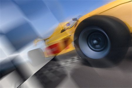 Blurred View of Formula Race Car And Flag Stock Photo - Rights-Managed, Code: 700-00027010