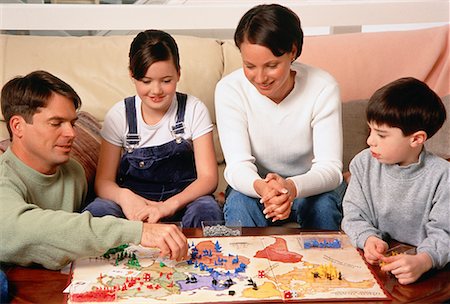 family caucasian playing board game - Family Playing Board Game Stock Photo - Rights-Managed, Code: 700-00027476