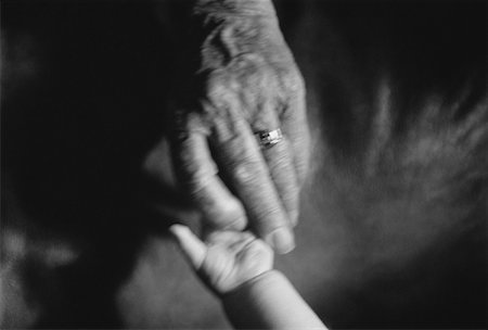 Close-Up of Mature Person and Child Holding Hands Foto de stock - Con derechos protegidos, Código: 700-00028337