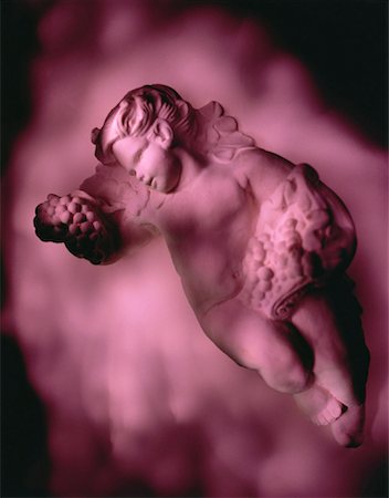 putti sculpture - Sculpture of Cherub Holding Grapes Stock Photo - Rights-Managed, Code: 700-00028332