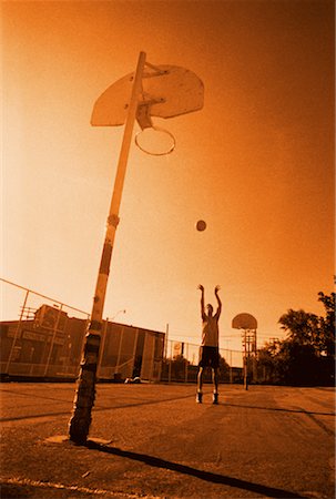 simsearch:700-00561360,k - Man Playing Basketball Outdoors Stock Photo - Rights-Managed, Code: 700-00029317