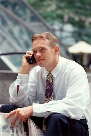 Homme d'affaires à l'aide de téléphone portable Photographie de stock - Rights-Managed, Code: 700-00029630