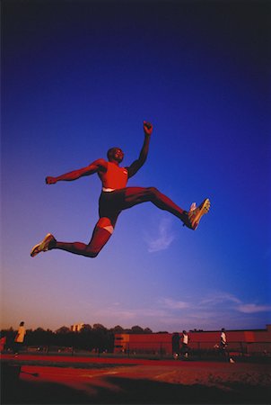 salto em distância - Man Long Jumping Foto de stock - Direito Controlado, Número: 700-00029794