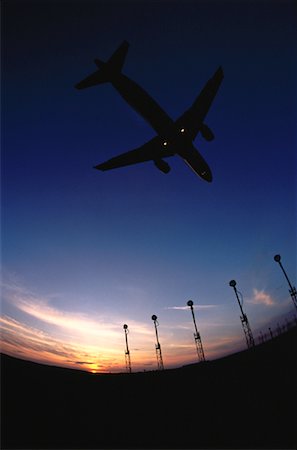 simsearch:700-00026618,k - Silhouette of Aiplane in Flight At Dusk Stock Photo - Rights-Managed, Code: 700-00020219