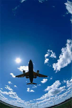 plane sky cloud looking up not people - Silhouette of Airplane Landing Stock Photo - Rights-Managed, Code: 700-00020220
