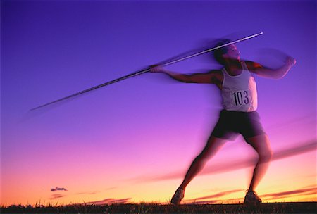 Man Throwing Javelin at Sunset Stock Photo - Rights-Managed, Code: 700-00020407