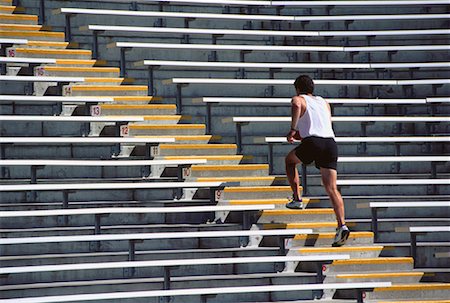 simsearch:700-00060793,k - Back View of Man Running Up Stadium Steps Stock Photo - Rights-Managed, Code: 700-00020408