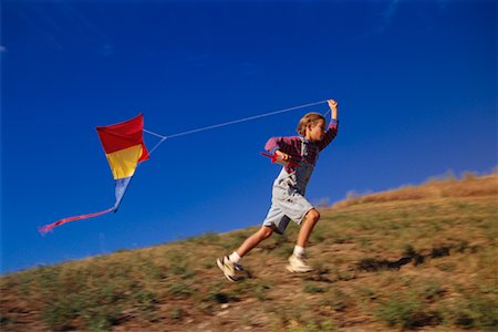 Young Boy Flying Kite Stock Photo - Rights-Managed, Code: 700-00020628