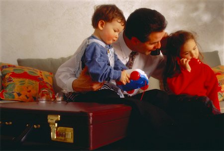 simsearch:700-00020781,k - Father Sitting on Sofa with Son and Daughter Stock Photo - Rights-Managed, Code: 700-00020782