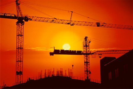 simsearch:600-02886427,k - Silhouette of Construction Cranes At Sunset Stock Photo - Rights-Managed, Code: 700-00021060
