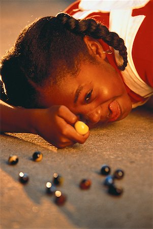 Kids playing with store marbles