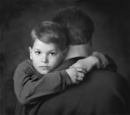 sad boy in black and white - Father and Son Embracing Stock Photo - Rights-Managed, Code: 700-00021501