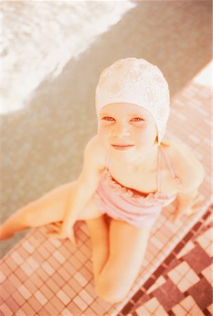 simsearch:700-00091319,k - Overhead View of Girl in Swimwear Near Swimming Pool Foto de stock - Con derechos protegidos, Código: 700-00021572