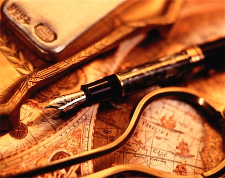 Fountain Pen and Callipers on Antique Map Stock Photo - Rights-Managed, Code: 700-00022766