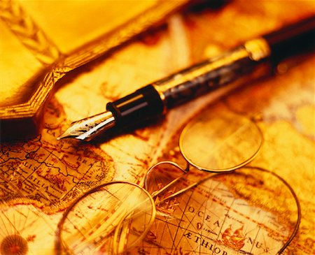 Fountain Pen and Eyeglasses on Antique Map Stock Photo - Rights-Managed, Code: 700-00022818