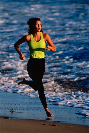 simsearch:700-02265472,k - Woman Running on Beach at Sunset Zuma Beach, California, USA Stock Photo - Rights-Managed, Code: 700-00023216