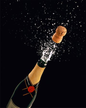 popping champagne cork - Cork Popping Out of Champagne Bottle Stock Photo - Rights-Managed, Code: 700-00023341