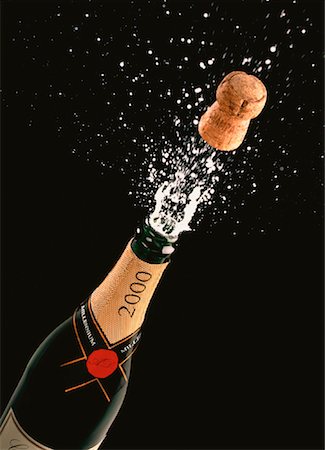 popping champagne cork - Cork Popping Out of Year 2000 Champagne Bottle Stock Photo - Rights-Managed, Code: 700-00023342