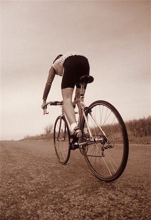 Back View of Person Cycling Stock Photo - Rights-Managed, Code: 700-00023504