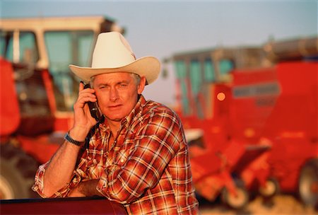 Portrait of Farmer Using Cell Phone Outdoors St. Agathe, Manitoba, Canada Stock Photo - Rights-Managed, Code: 700-00023752