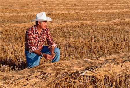 Farmer Kneeling in Barley Field St. Norbert, Manitoba, Canada Stock Photo - Rights-Managed, Code: 700-00023753