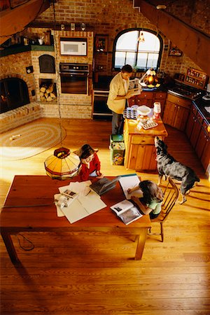 dogs and woman in kitchen - Family at Home Stock Photo - Rights-Managed, Code: 700-00034200