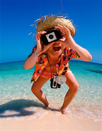 person in hawaiian shirt - Portrait of Man Taking Photograph On Beach Stock Photo - Rights-Managed, Code: 700-00034407