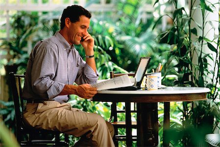 small business phone outside - Man Using Laptop on Patio Singapore Stock Photo - Rights-Managed, Code: 700-00034832
