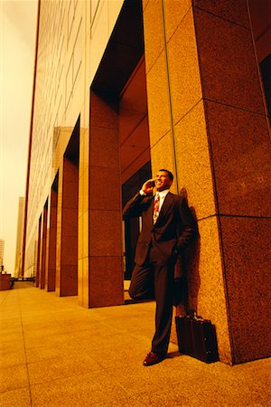 simsearch:700-00049474,k - Businessman Using Cell Phone Outdoors Stock Photo - Rights-Managed, Code: 700-00035136